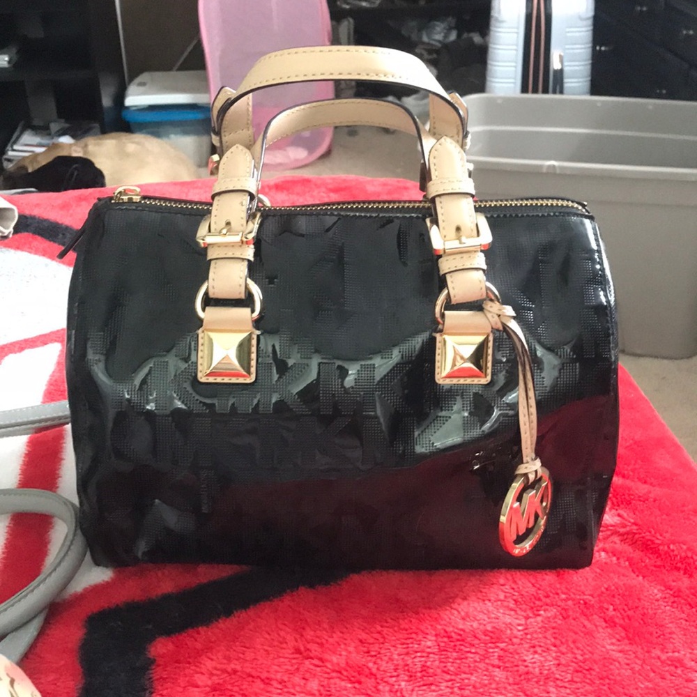 A Michael kors duffle purse.